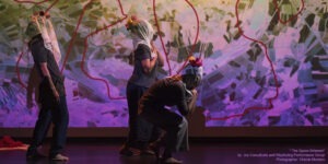 3 women dancing in performance